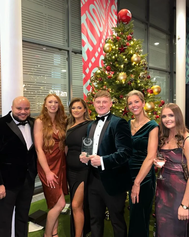 Experienced Energy Solutions team celebrating with their TELCA award